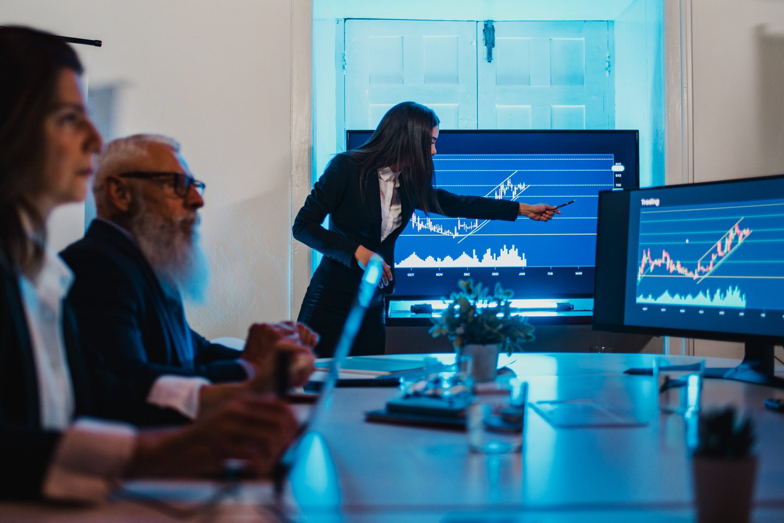 Business professionals analyzing financial data and market trends